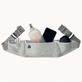 A light gray Strive brand waist bag filled with various items like a water bottle, phone, and earbud case, shown against a plain off-white background.
