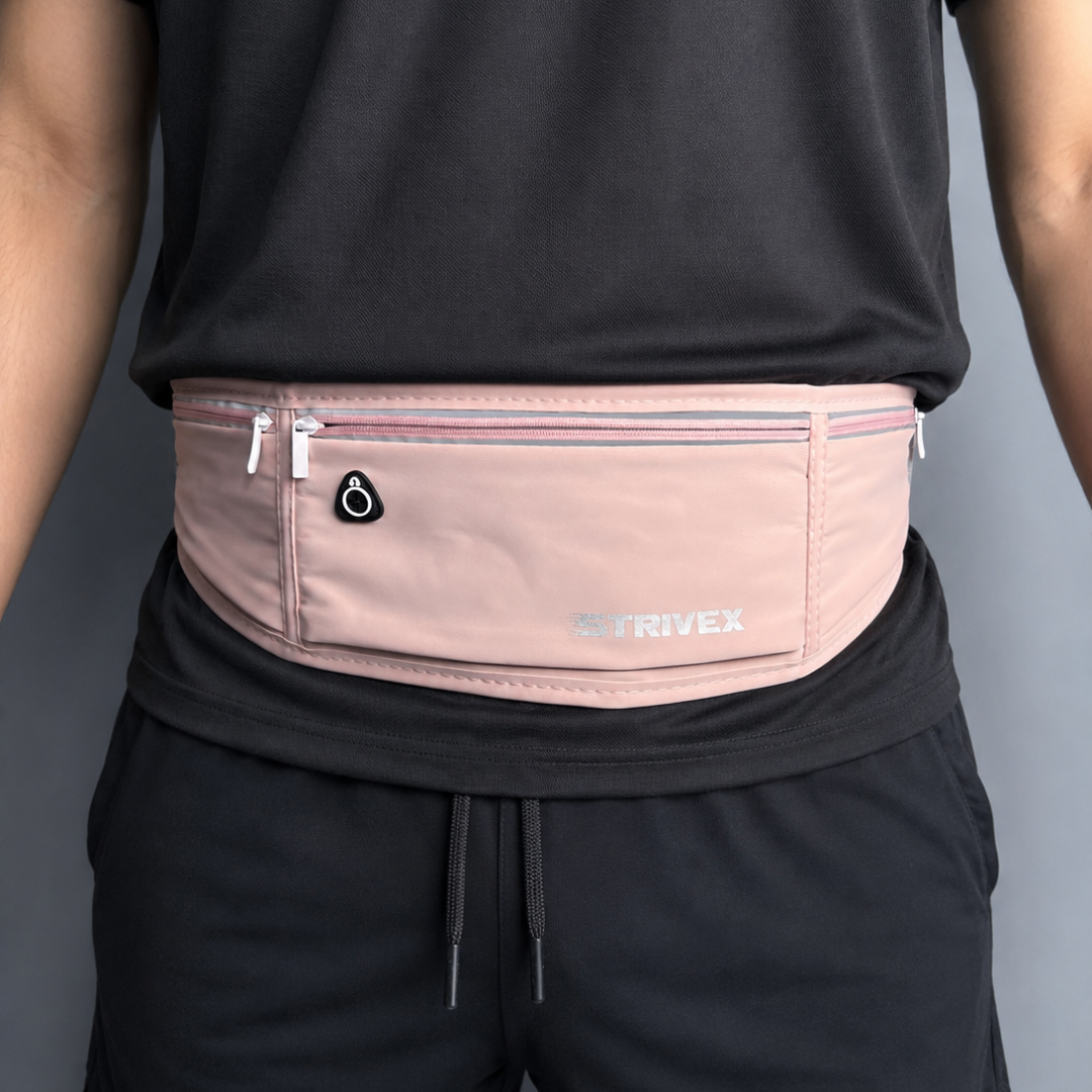A person wearing a light pink strivex waist pack belt 