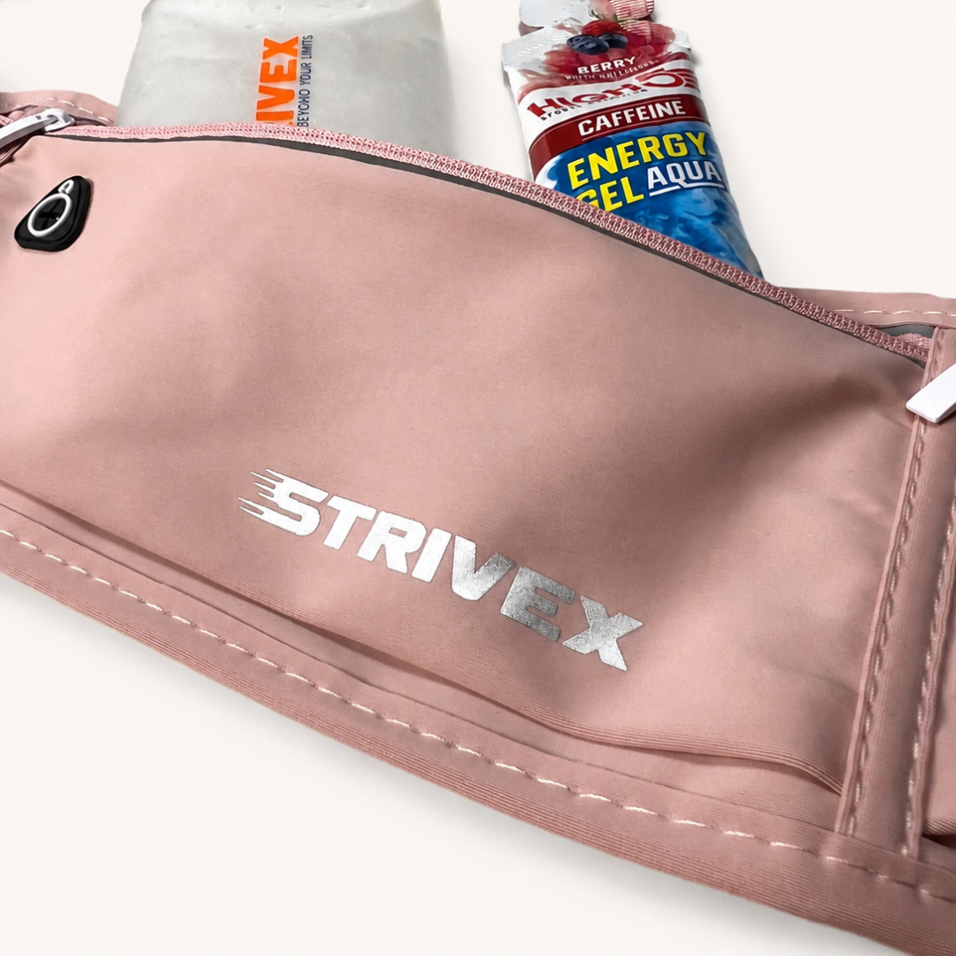 A close-up of a pink Strivex waist bag with a silver logo, showing its zippered compartments