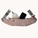 A pink and gray SRIVEX waist bag move shown with its front pockets filled with a water bottle, a smartphone, earbuds case, and a snack pack, on a solid off-white background.