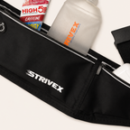 Black Strivex waist pack pouch shown with a white bottle and a tube of energy drink tucked into the compartments, on a light beige background.